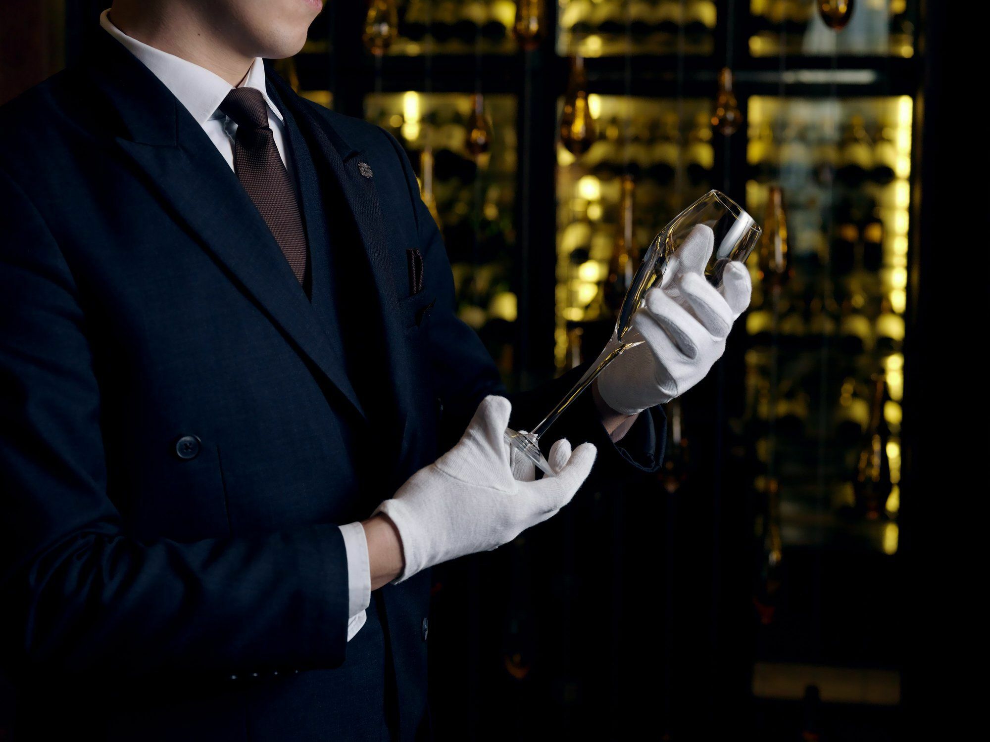 The St. Regis Astana Hotel Exterior foto A sommelier inspecting a bottle of wine